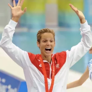 Swimmer Dara Torres celebrates a championship medal
