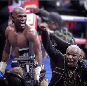 Floyd Mayweather celebrates a victory with his Father in shot